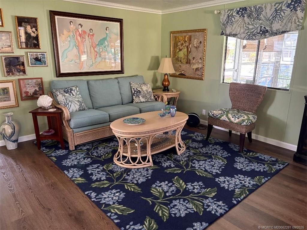 2686 Southwest Monarch Trail Stuart, FL 34997 - Photo 6 of 15 a living room with furniture a rug and a window