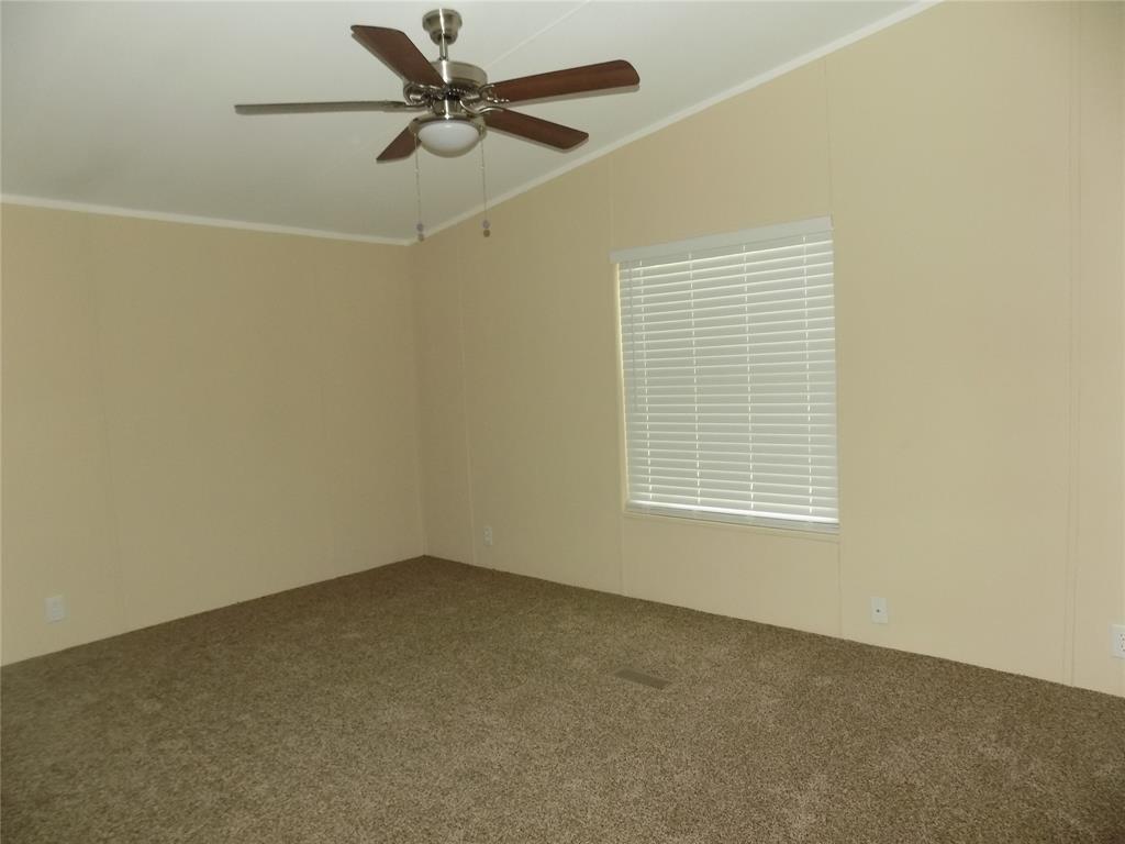 203 South Ridgeview Court Azle, TX 76020 - Photo 29 of 29 Spacious primary bedroom, with a split bedroom floor plan.