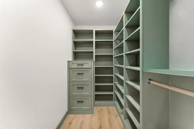 a view of yard with swimming pool and green space