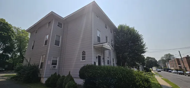 a view of a street with brick building in front of it