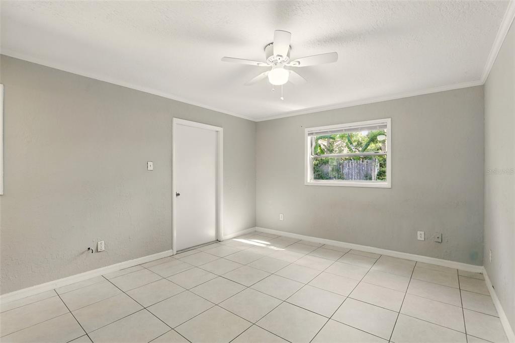 1617 Acacia Road Apopka, FL 32712 - Photo 15 of 30 a view of an empty room with chandelier fan
