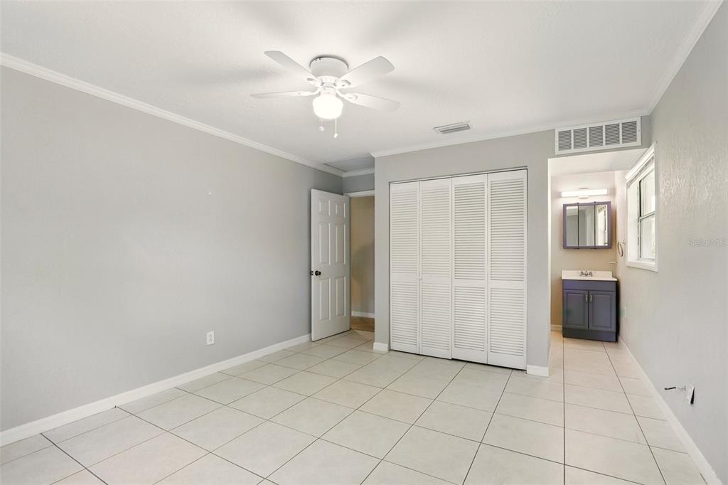 1617 Acacia Road Apopka, FL 32712 - Photo 16 of 30 a view of an empty room with a fan