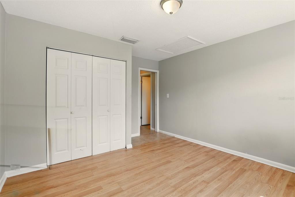 1617 Acacia Road Apopka, FL 32712 - Photo 19 of 30 a view of an empty room with wooden floor