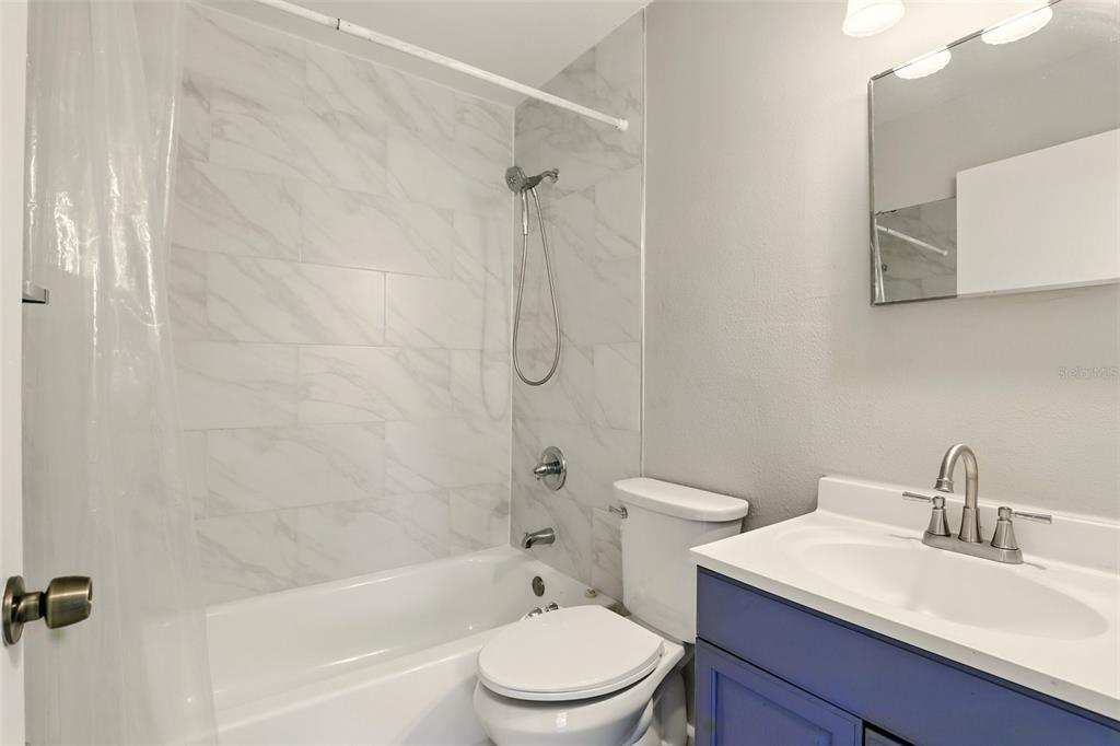 1617 Acacia Road Apopka, FL 32712 - Photo 20 of 30 a bathroom with a sink toilet and shower