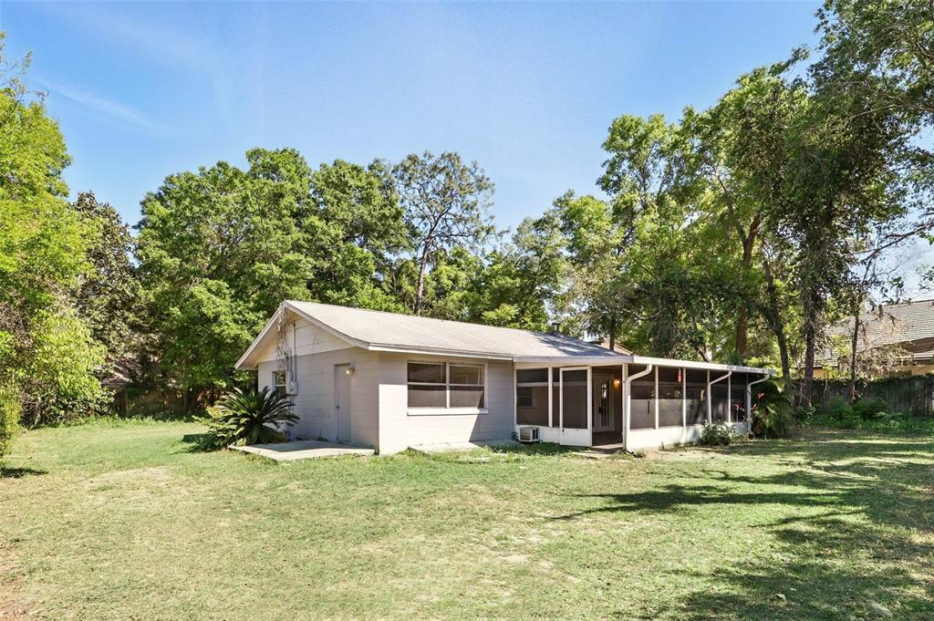 1617 Acacia Road Apopka, FL 32712 - Photo 2 of 30 a front view of a house with a garden