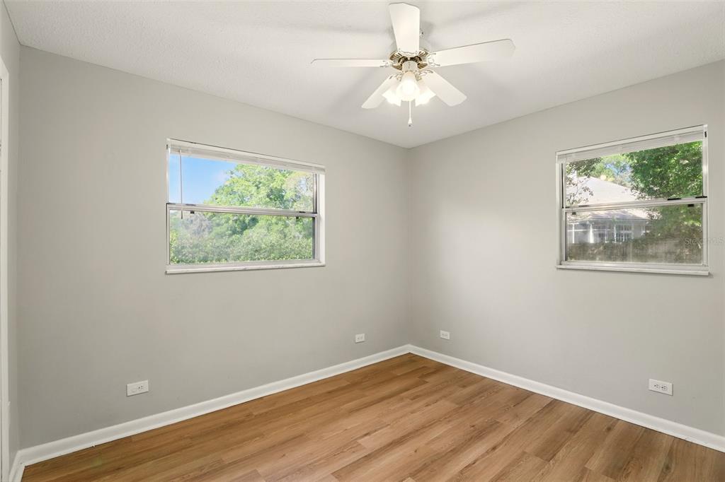1617 Acacia Road Apopka, FL 32712 - Photo 21 of 30 an empty room with wooden floor and window