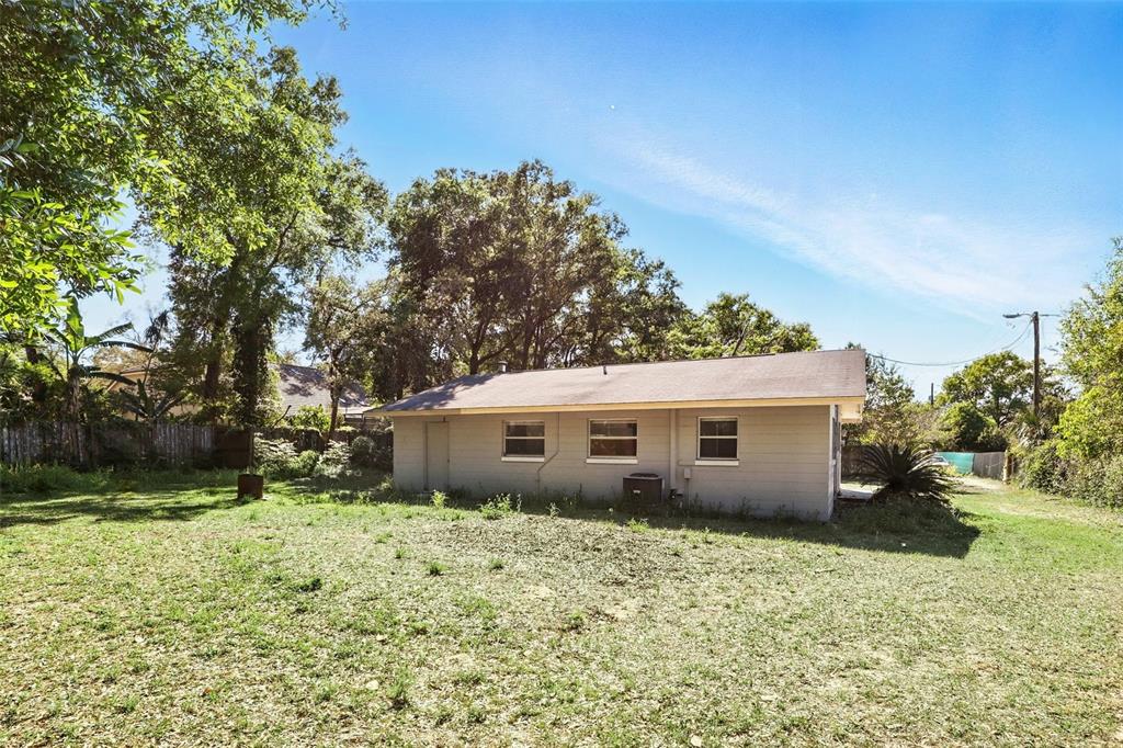 1617 Acacia Road Apopka, FL 32712 - Photo 26 of 30 a view of a house with a backyard