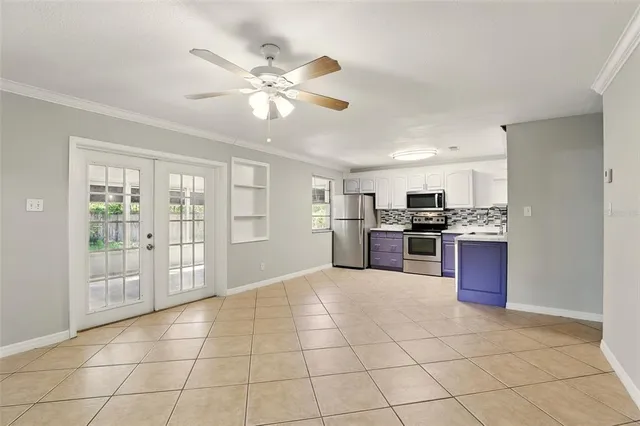 a open kitchen with cabinets and stainless steel appliances