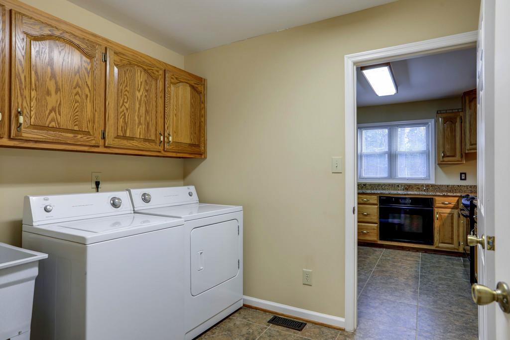 5056 Joe Peay Road Spring Hill, TN 37174 - Photo 16 of 30 a utility room with dryer and washer