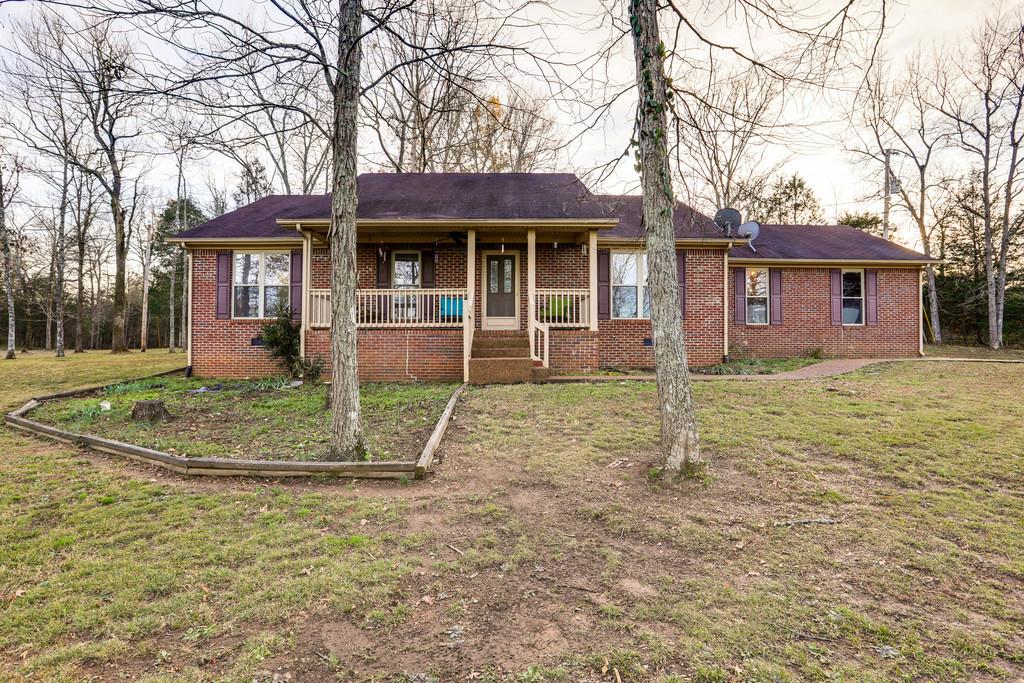 5056 Joe Peay Road Spring Hill, TN 37174 - Photo 6 of 30 a front view of a house with garden