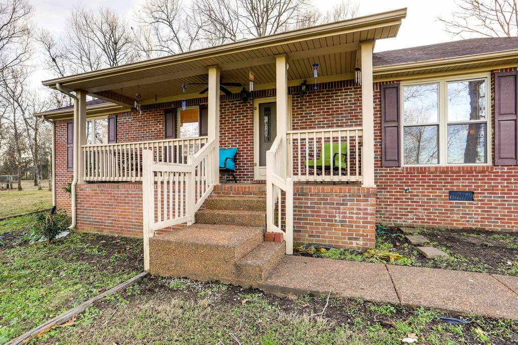 5056 Joe Peay Road Spring Hill, TN 37174 - Photo 7 of 30 a front view of a house with a porch