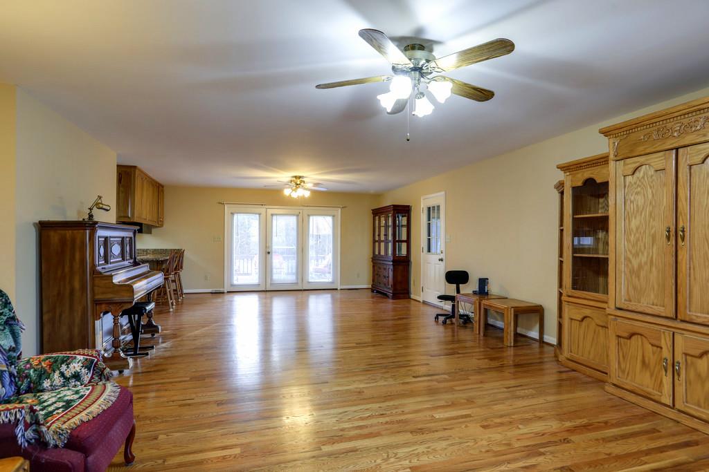 5056 Joe Peay Road Spring Hill, TN 37174 - Photo 8 of 30 a view of a dining room with furniture and wooden floor