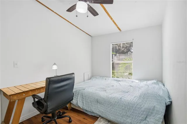 a bathroom with a sink a toilet and shower curtain