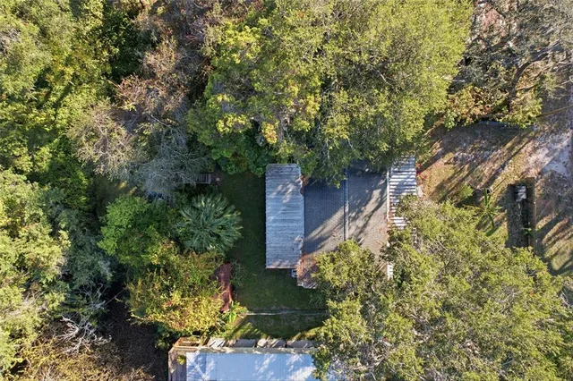 a aerial view of a house with a yard and garden