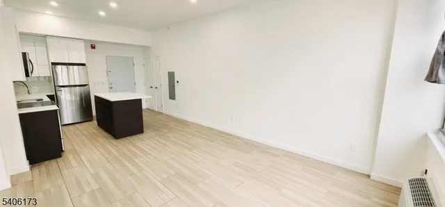 a room with wooden cabinets and wooden floor