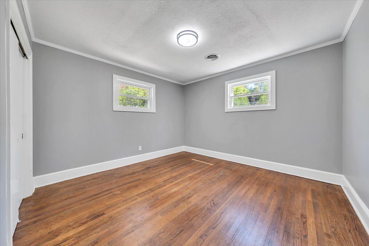 112 Frankie Lane Stuart, VA 24171 - Photo 26 of 57 an empty room with wooden floor and window