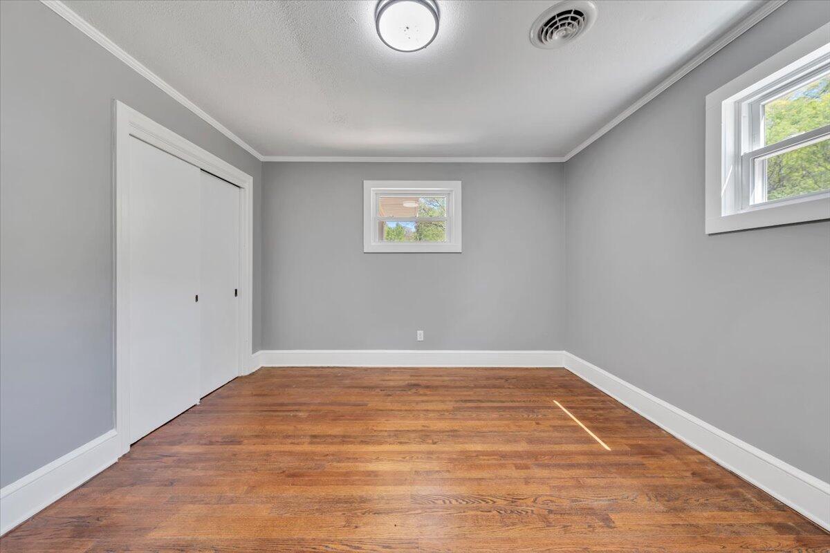 112 Frankie Lane Stuart, VA 24171 - Photo 27 of 57 an empty room with a window and wooden floor