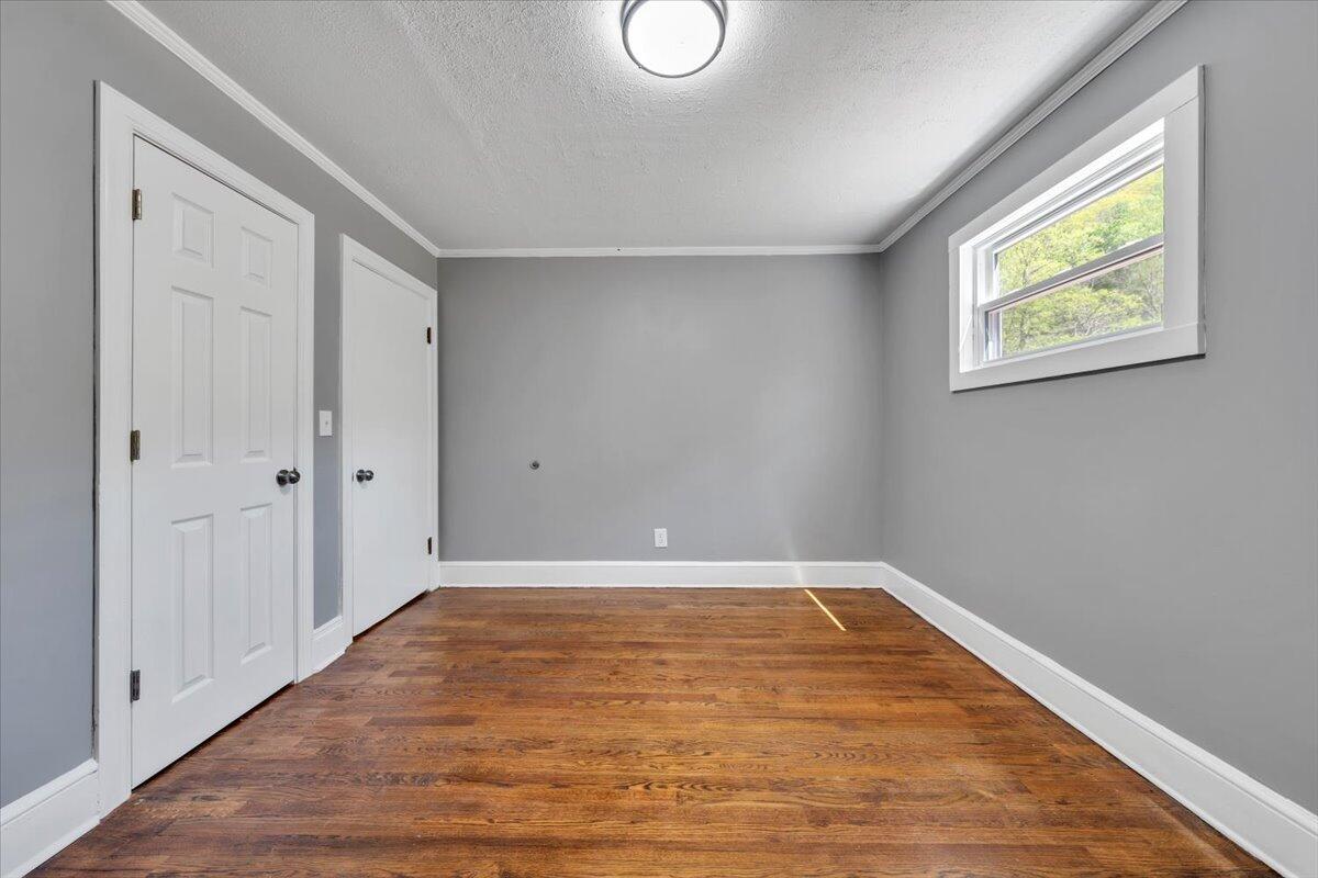 112 Frankie Lane Stuart, VA 24171 - Photo 29 of 57 a view of an empty room with wooden floor and closet
