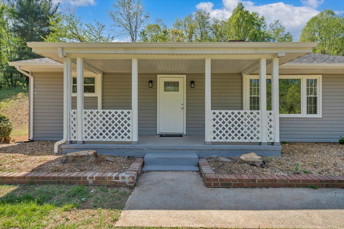 112 Frankie Lane Stuart, VA 24171 - Photo 3 of 57 front view of a house with a yard