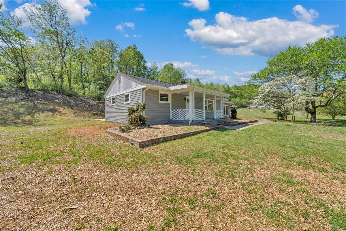 112 Frankie Lane Stuart, VA 24171 - Photo 55 of 57 a view of a house with a backyard and a tree
