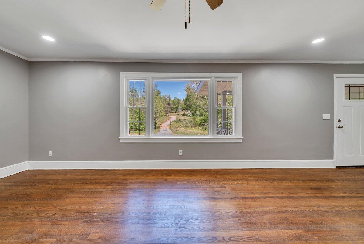 112 Frankie Lane Stuart, VA 24171 - Photo 8 of 57 an empty room with wooden floor and windows