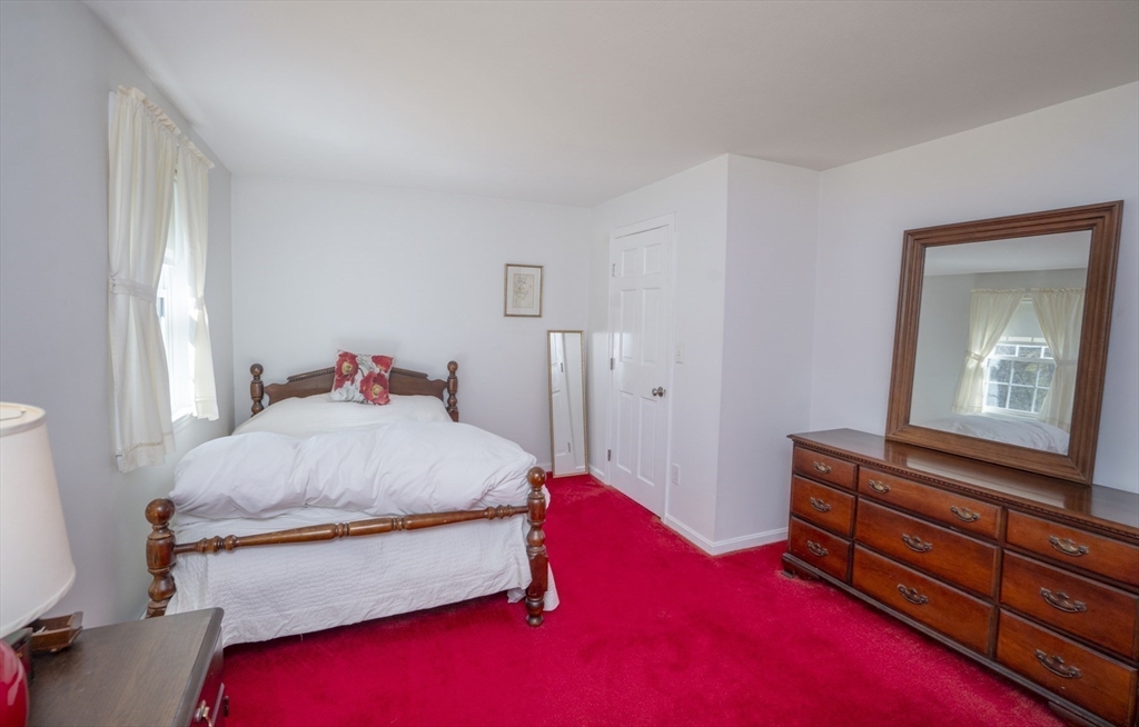 22 Elizabeth Street Amesbury, MA 01913 - Photo 19 of 38 a bedroom with a bed and a dresser