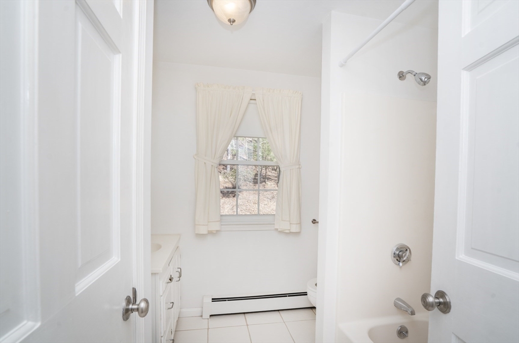 22 Elizabeth Street Amesbury, MA 01913 - Photo 24 of 38 a bathroom with a window