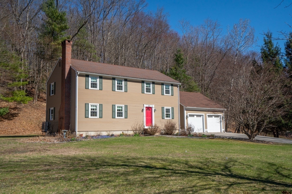 22 Elizabeth Street Amesbury, MA 01913 - Photo 27 of 38 a front view of a house with a yard