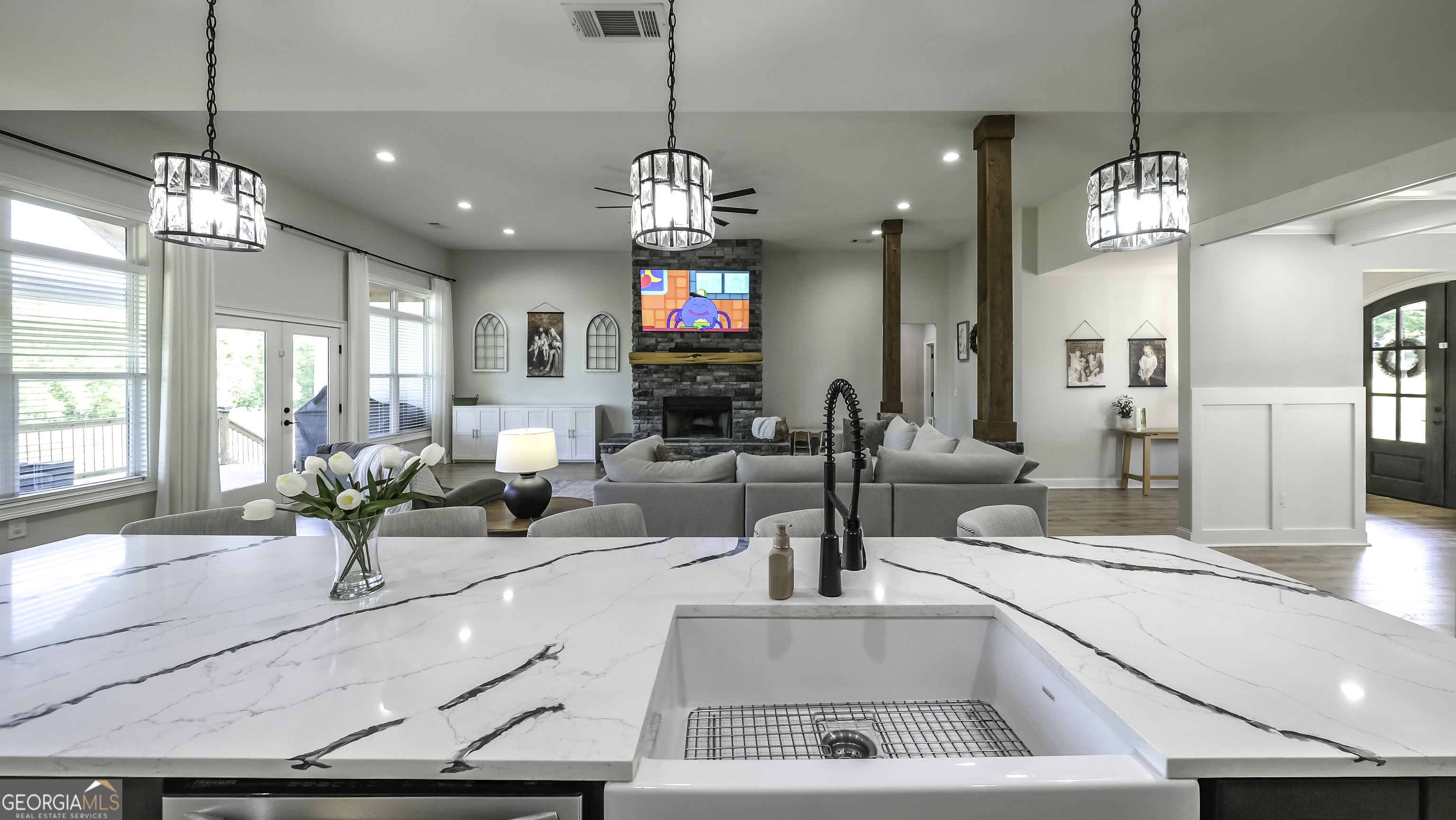 2392 Welcome Road Roopville, GA 30170 - Photo 11 of 43 a view of a kitchen center island and living room