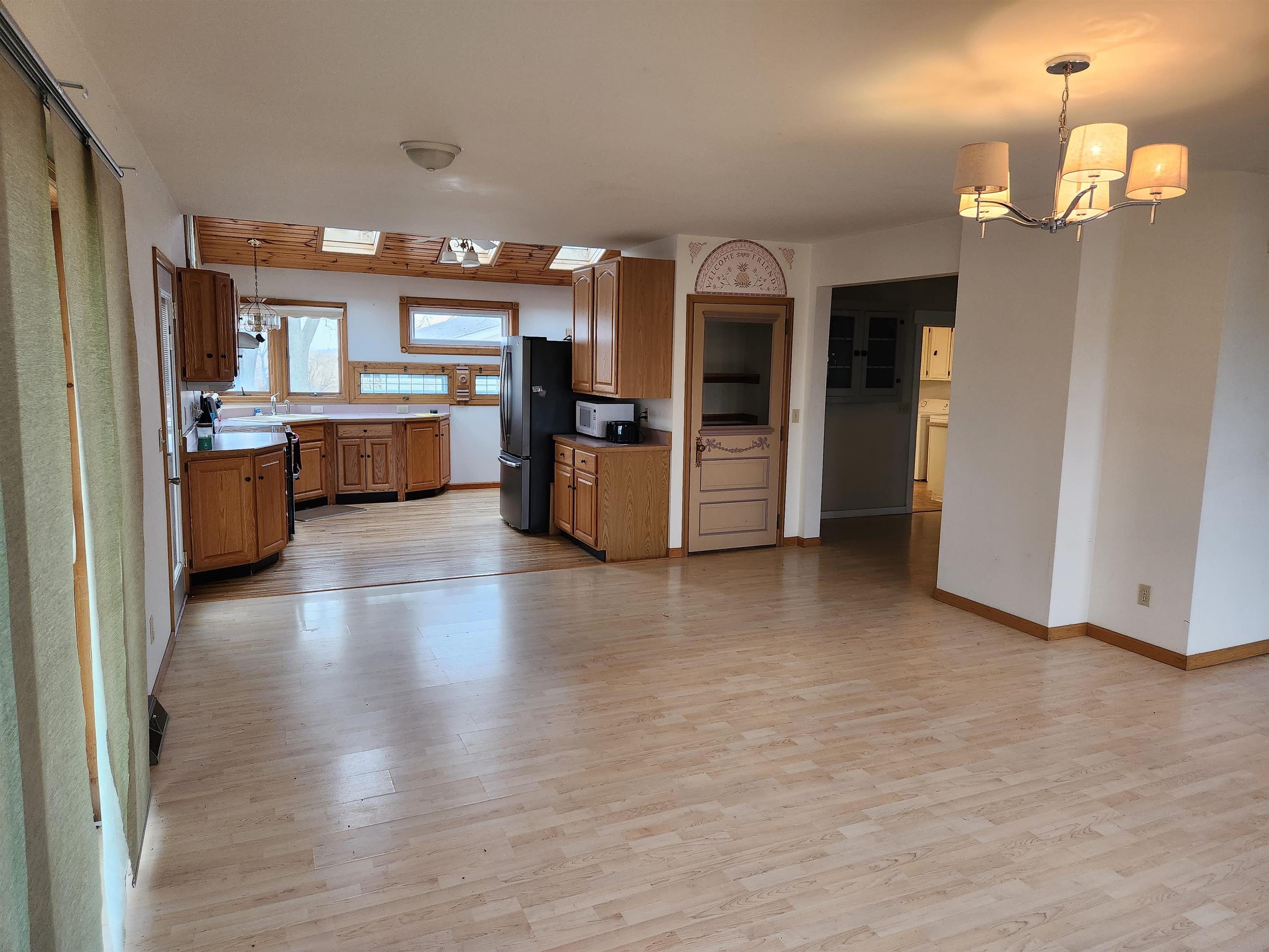 7082 South Hoosier Road Ashton, IL 61006 - Photo 13 of 48 a view of living room with furniture and kitchen view