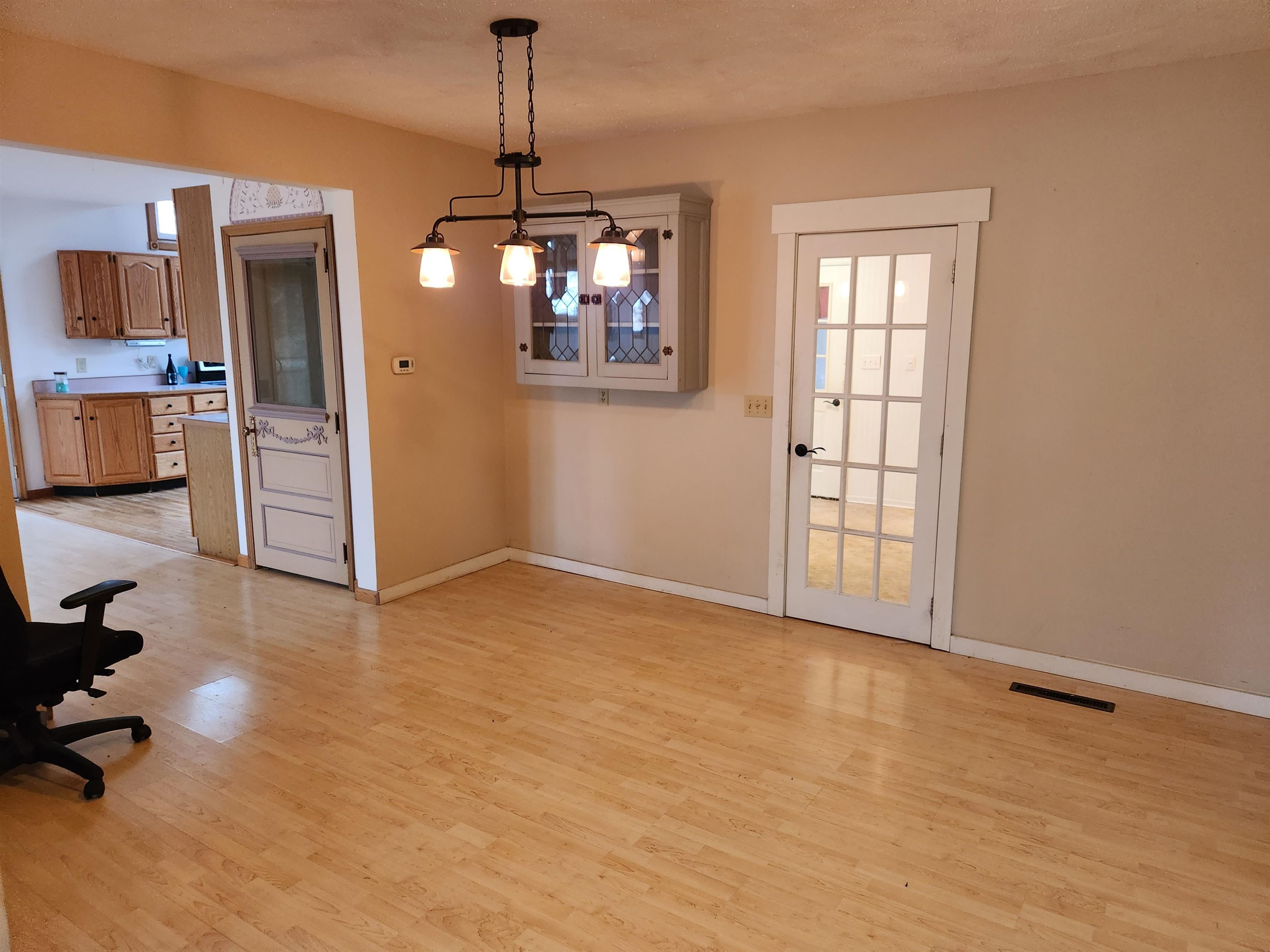 7082 South Hoosier Road Ashton, IL 61006 - Photo 18 of 48 a view of livingroom with hardwood floor and a kitchen