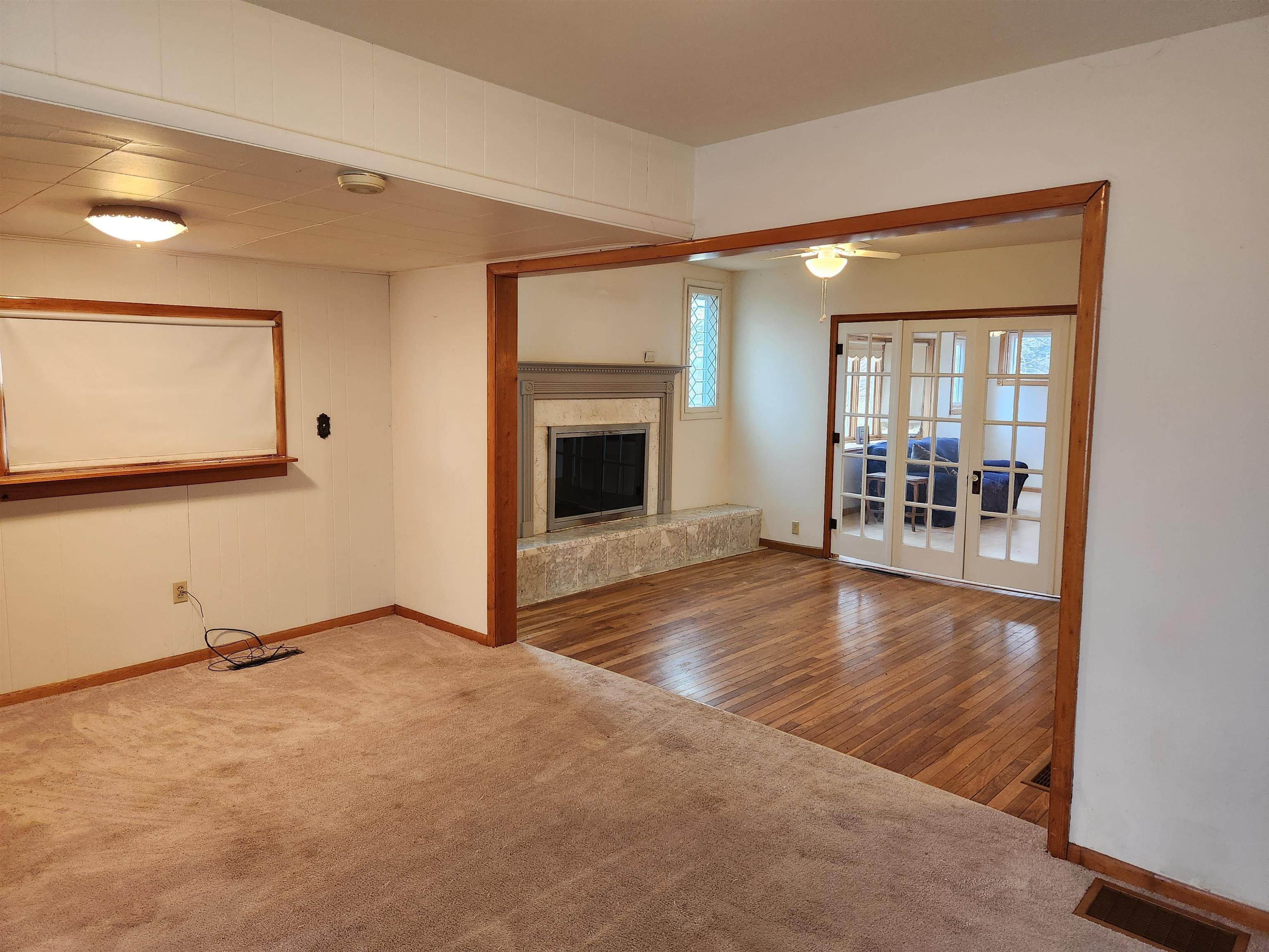 7082 South Hoosier Road Ashton, IL 61006 - Photo 26 of 48 a view of an empty room with window and fire place