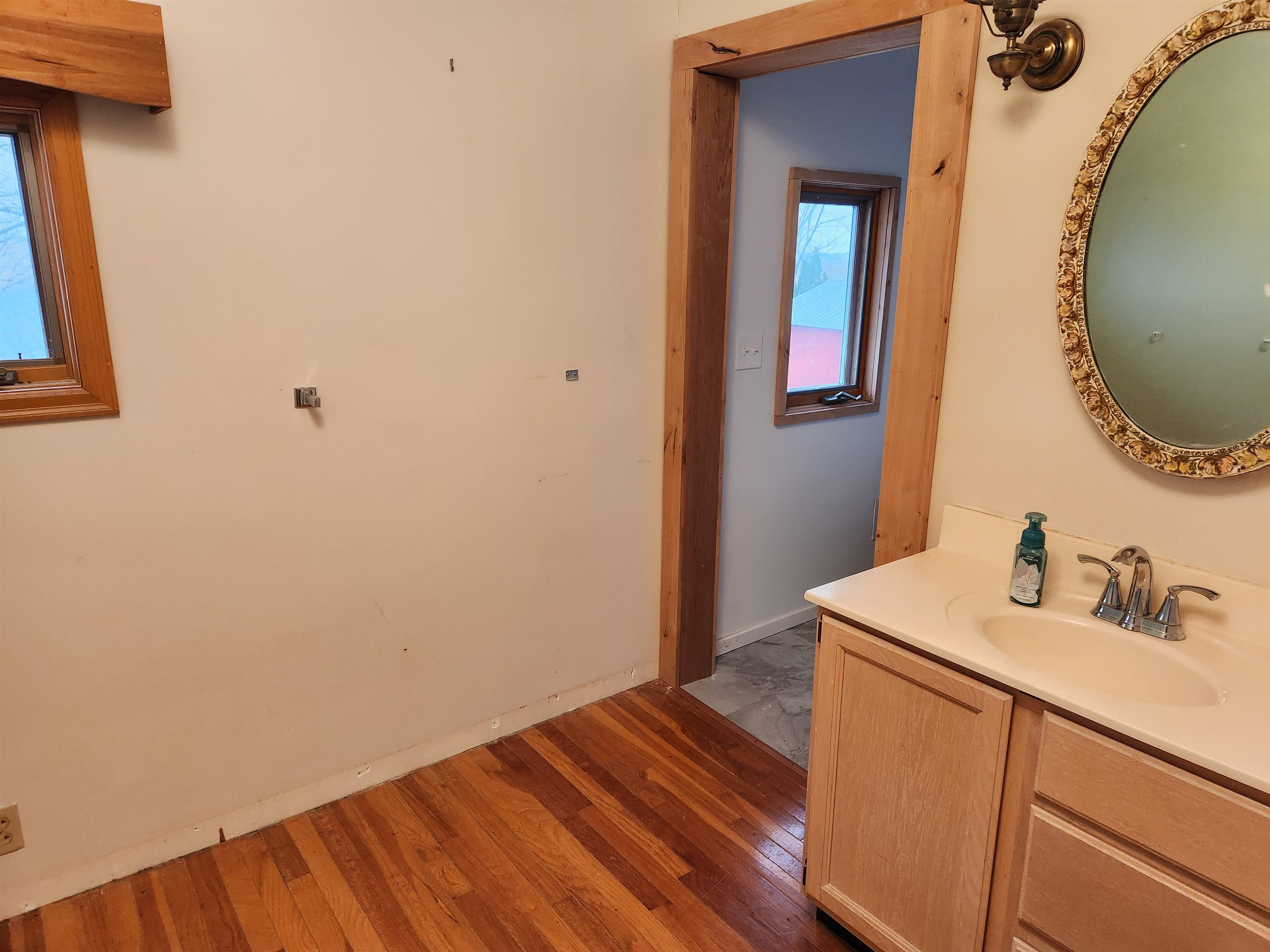 7082 South Hoosier Road Ashton, IL 61006 - Photo 33 of 48 a bathroom with a sink and a mirror