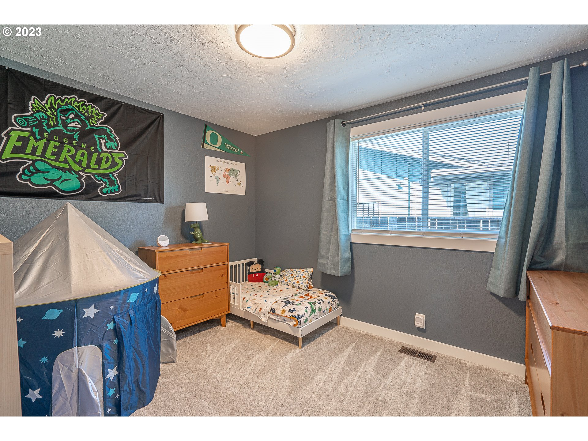 5040 Forsythia Street Springfield, OR 97478 - Photo 28 of 47 a bedroom with a bed and a window