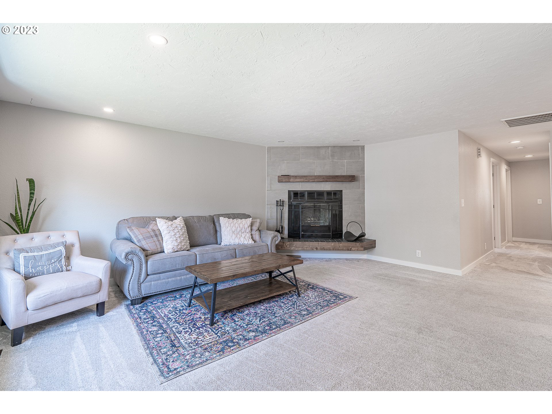 5040 Forsythia Street Springfield, OR 97478 - Photo 4 of 47 a living room with furniture and a fireplace