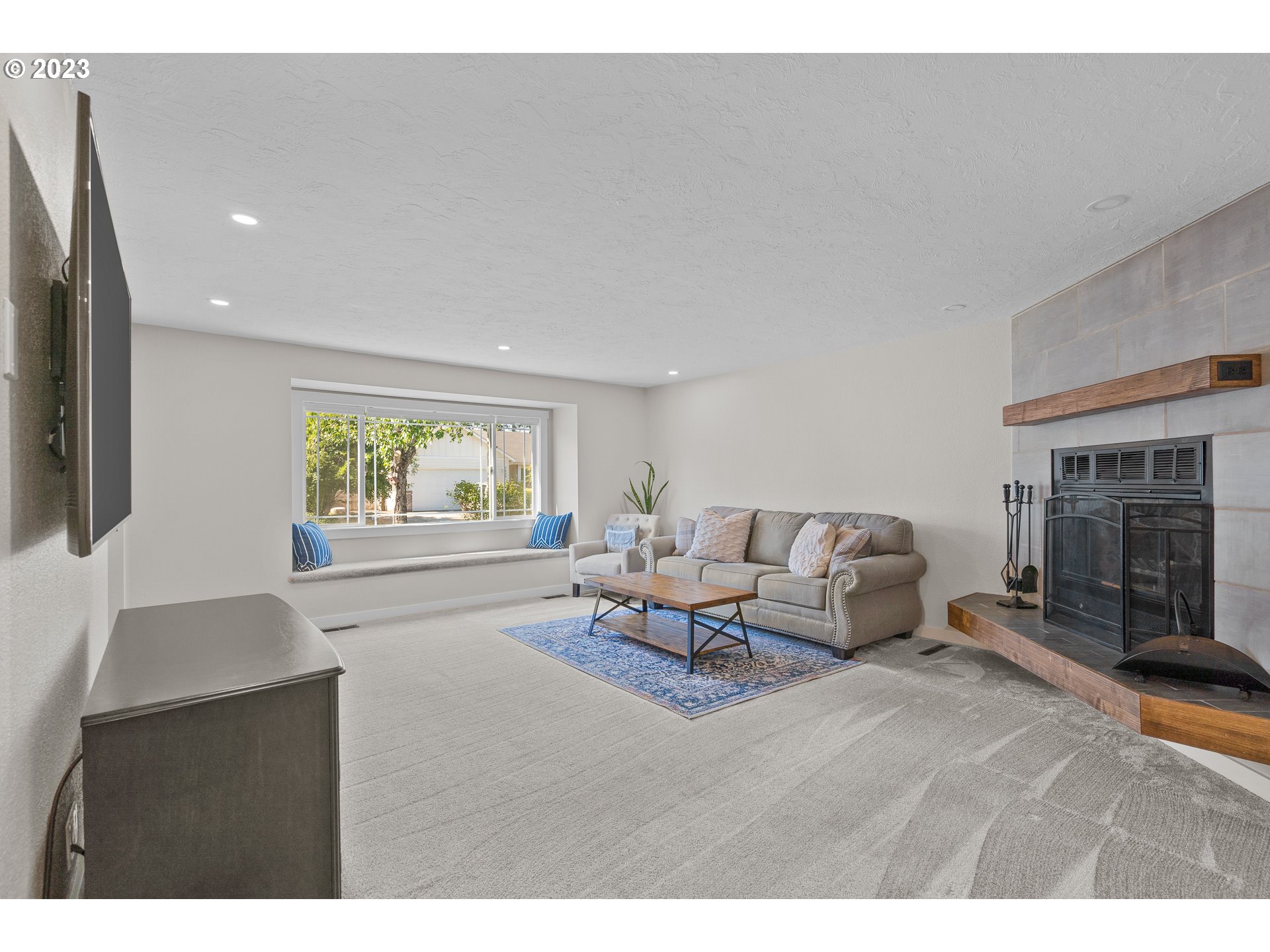 5040 Forsythia Street Springfield, OR 97478 - Photo 7 of 47 a living room with furniture and a fireplace