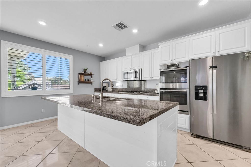 37656 Needlegrass Road Murrieta, CA 92563 - Photo 7 of 29 The massive center island is newly renovated.