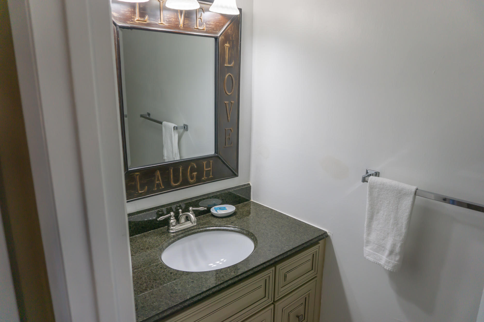 2000 Scenic Gulf Drive, Unit 5 Miramar Beach, FL 32550 - Photo 13 of 54 a bathroom with a granite countertop sink and a mirror