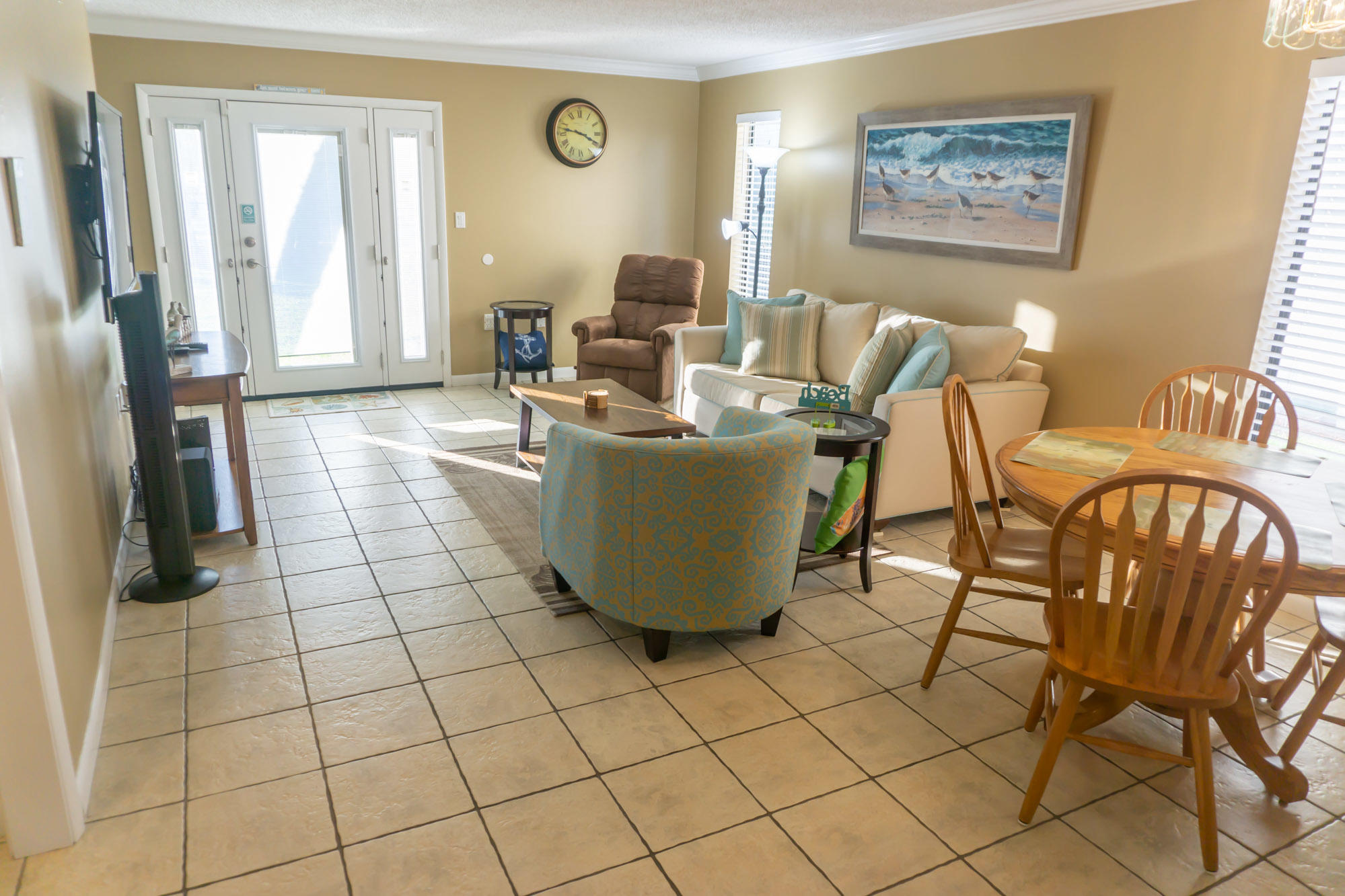 2000 Scenic Gulf Drive, Unit 5 Miramar Beach, FL 32550 - Photo 14 of 54 a living room with a couch and a table