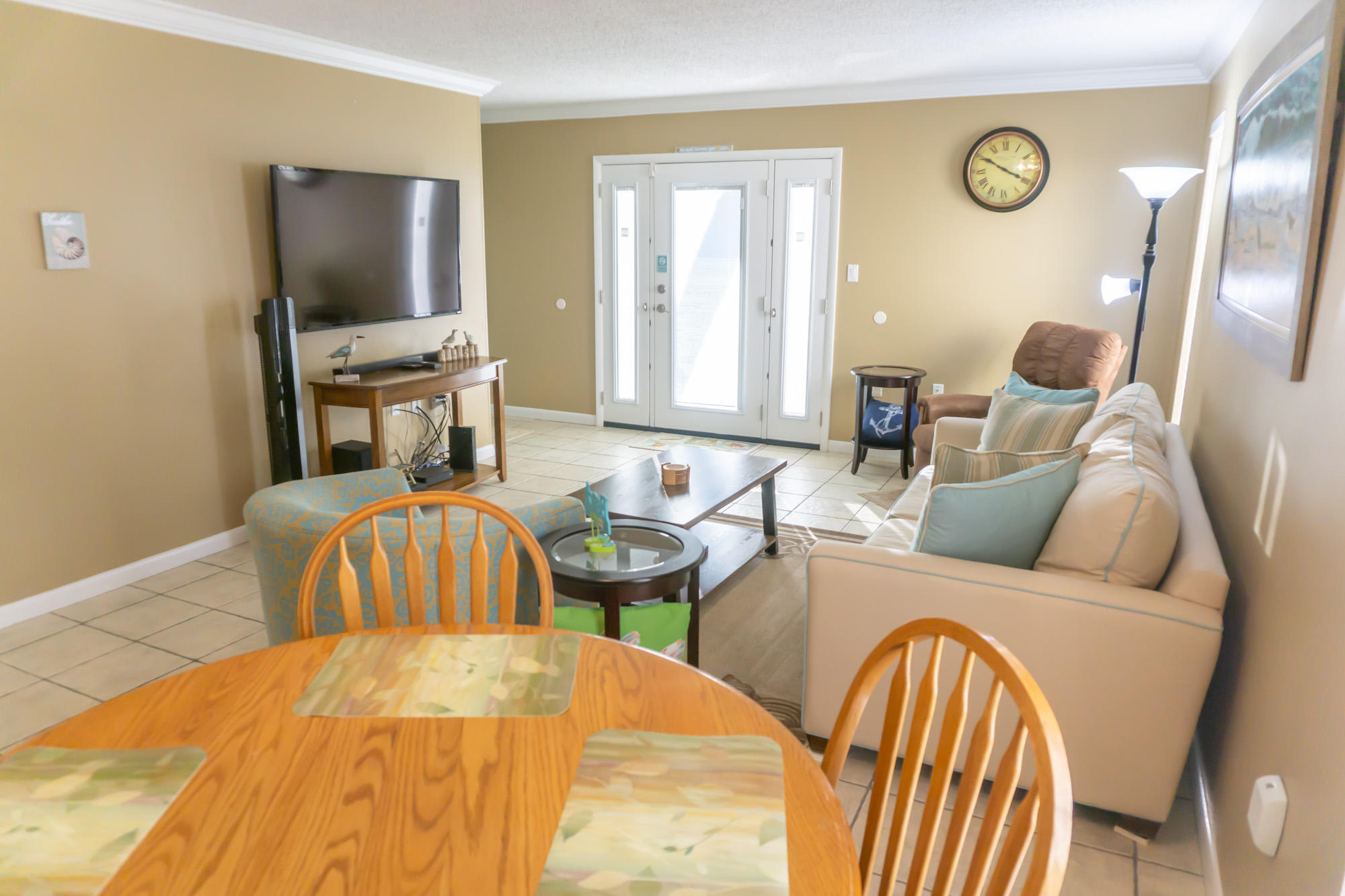 2000 Scenic Gulf Drive, Unit 5 Miramar Beach, FL 32550 - Photo 19 of 54 a living room with furniture and a flat screen tv