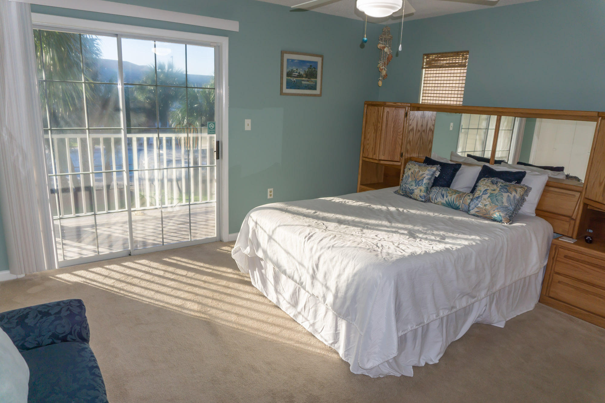 2000 Scenic Gulf Drive, Unit 5 Miramar Beach, FL 32550 - Photo 21 of 54 a bed sitting in a bedroom next to a window