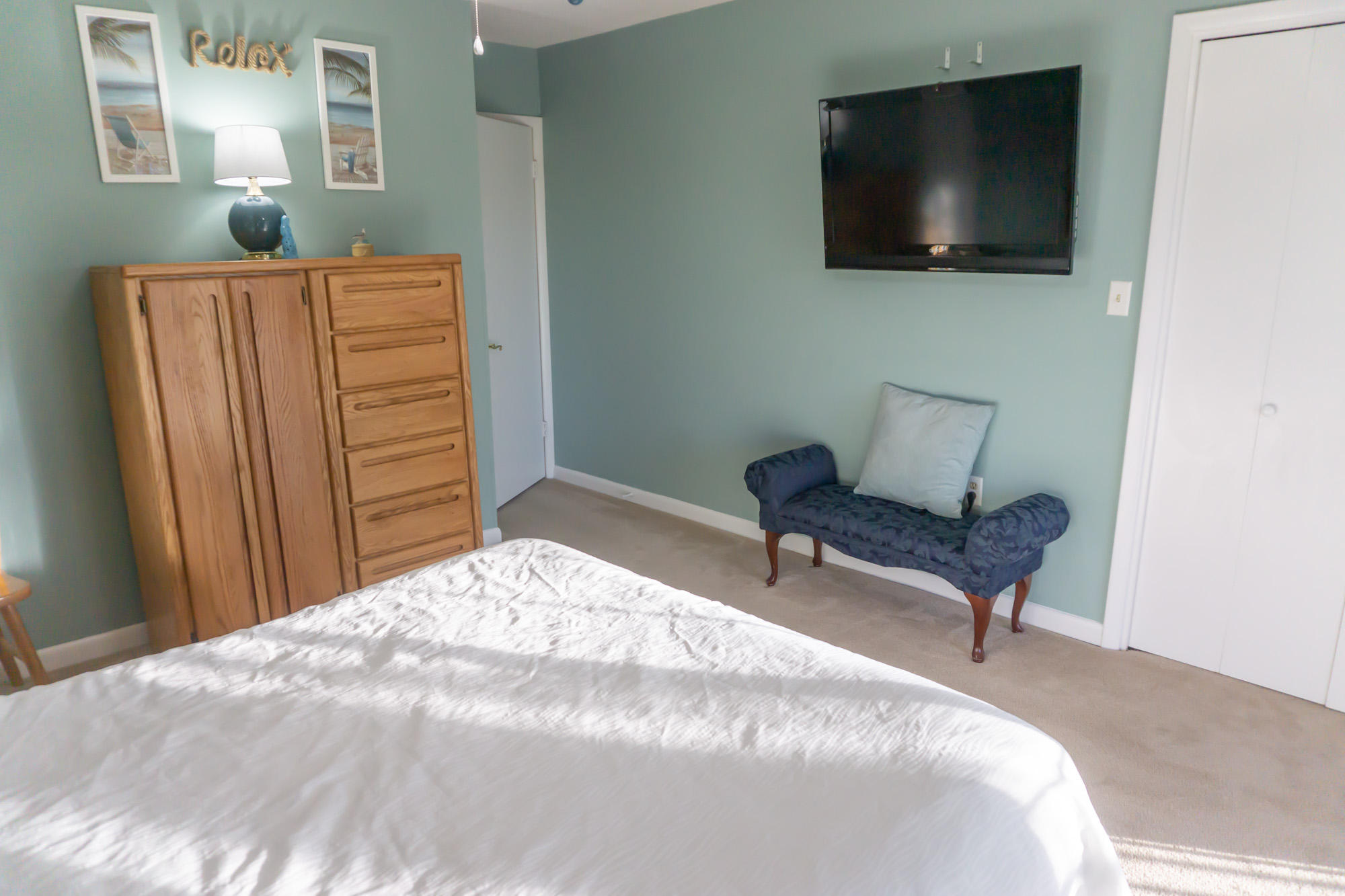 2000 Scenic Gulf Drive, Unit 5 Miramar Beach, FL 32550 - Photo 22 of 54 a bedroom with a bed and a flat screen tv