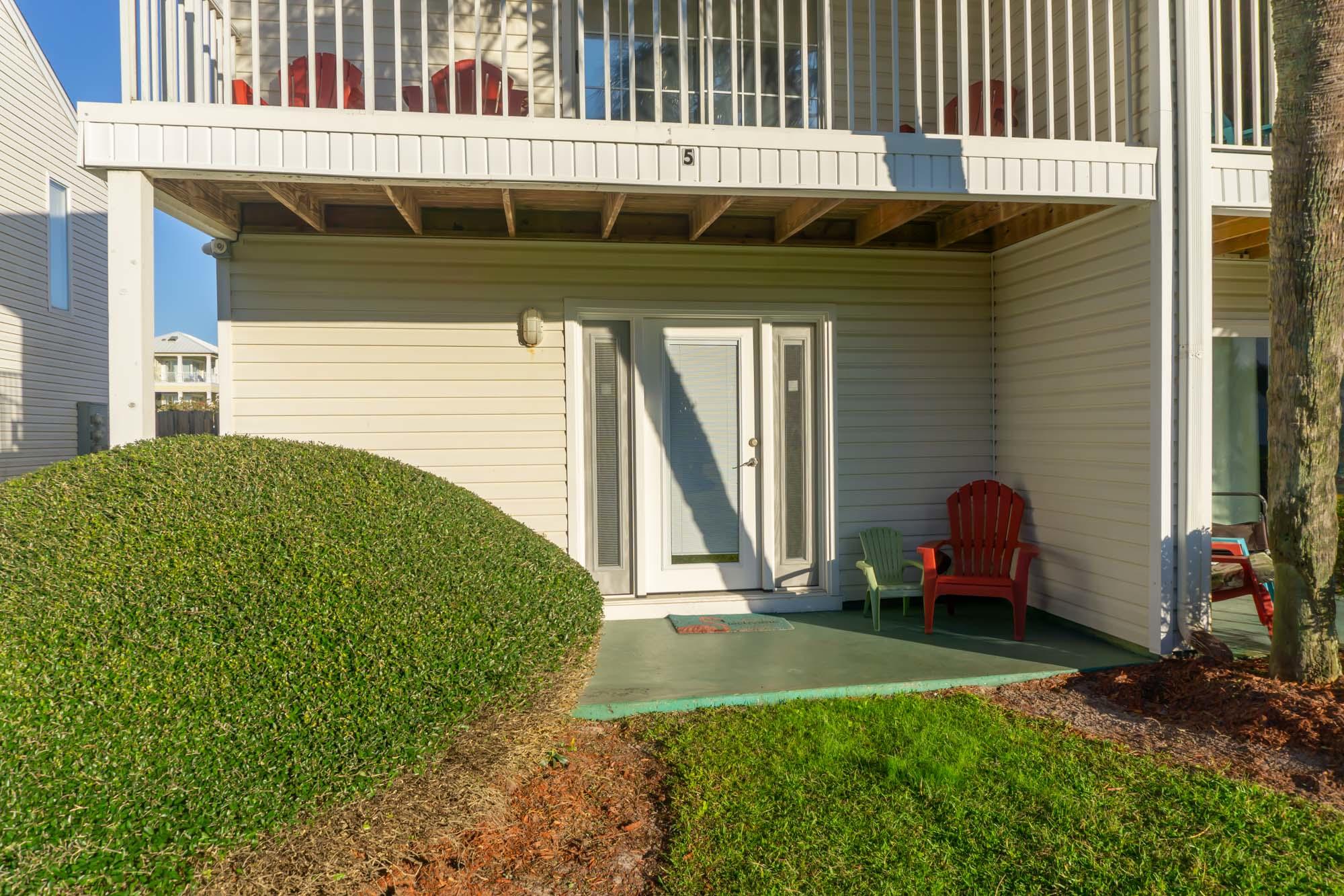 2000 Scenic Gulf Drive, Unit 5 Miramar Beach, FL 32550 - Photo 3 of 54 a front view of a house with garden