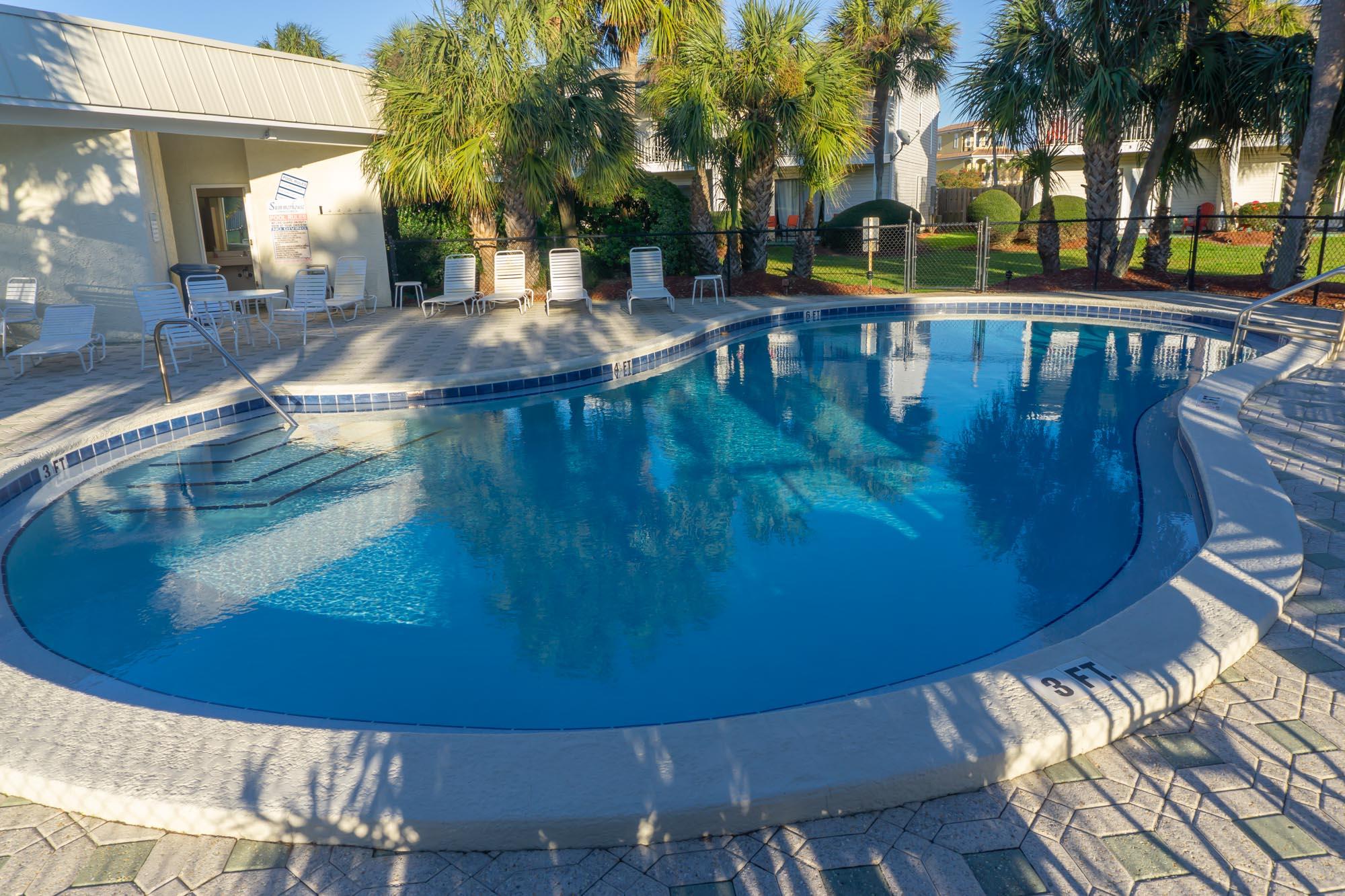 2000 Scenic Gulf Drive, Unit 5 Miramar Beach, FL 32550 - Photo 37 of 54 a view of a swimming pool with a patio