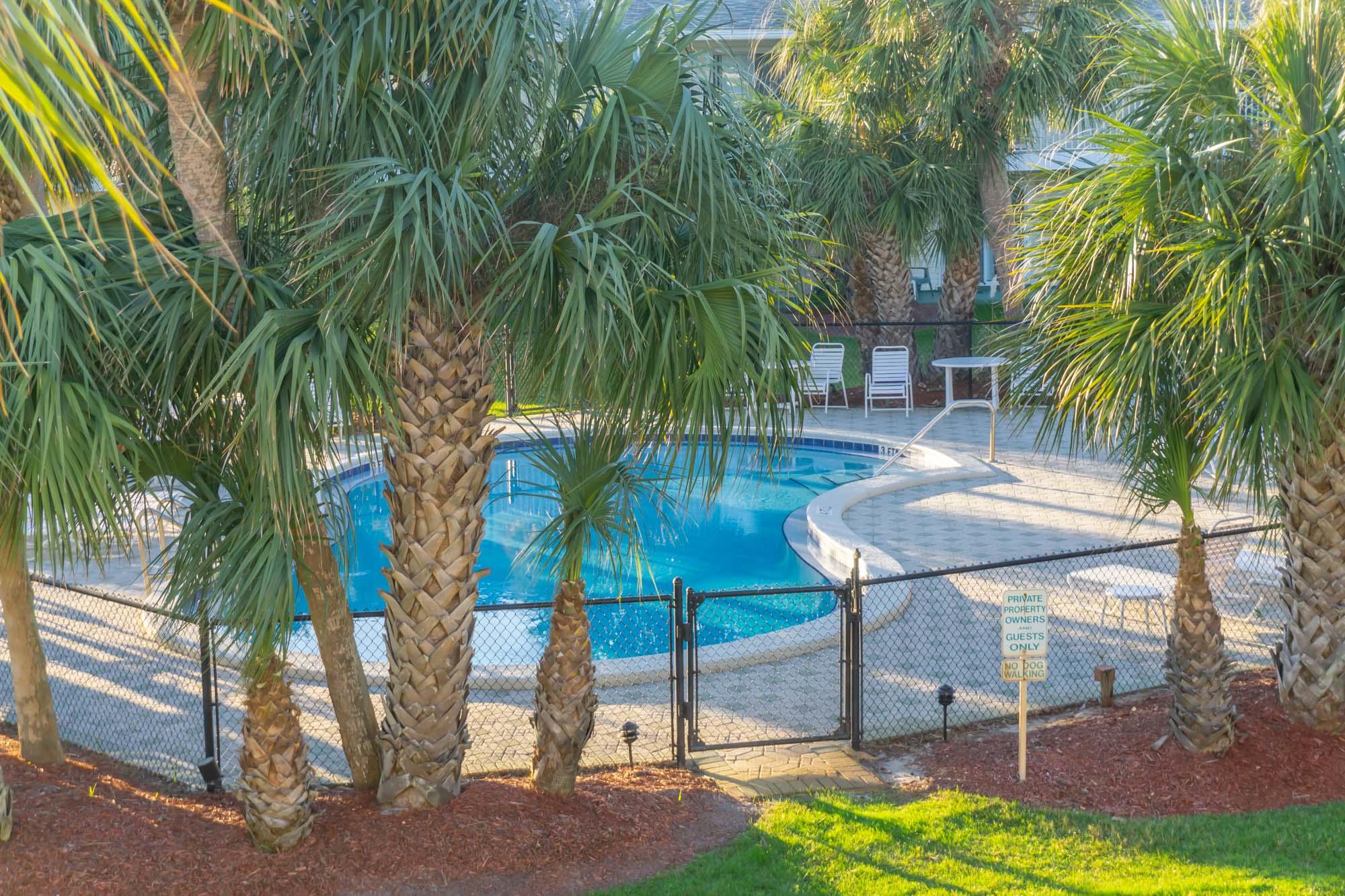 2000 Scenic Gulf Drive, Unit 5 Miramar Beach, FL 32550 - Photo 40 of 54 a view of a backyard with a patio