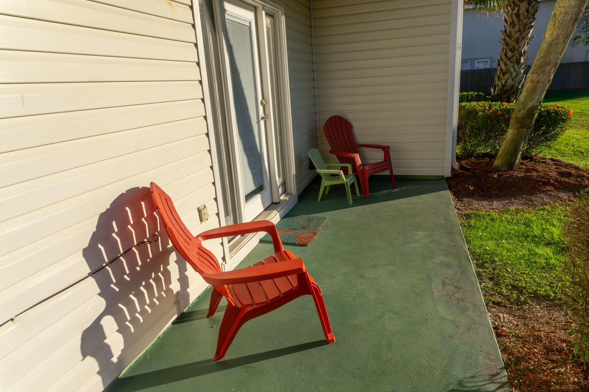 2000 Scenic Gulf Drive, Unit 5 Miramar Beach, FL 32550 - Photo 5 of 54 a view of a backyard with chairs