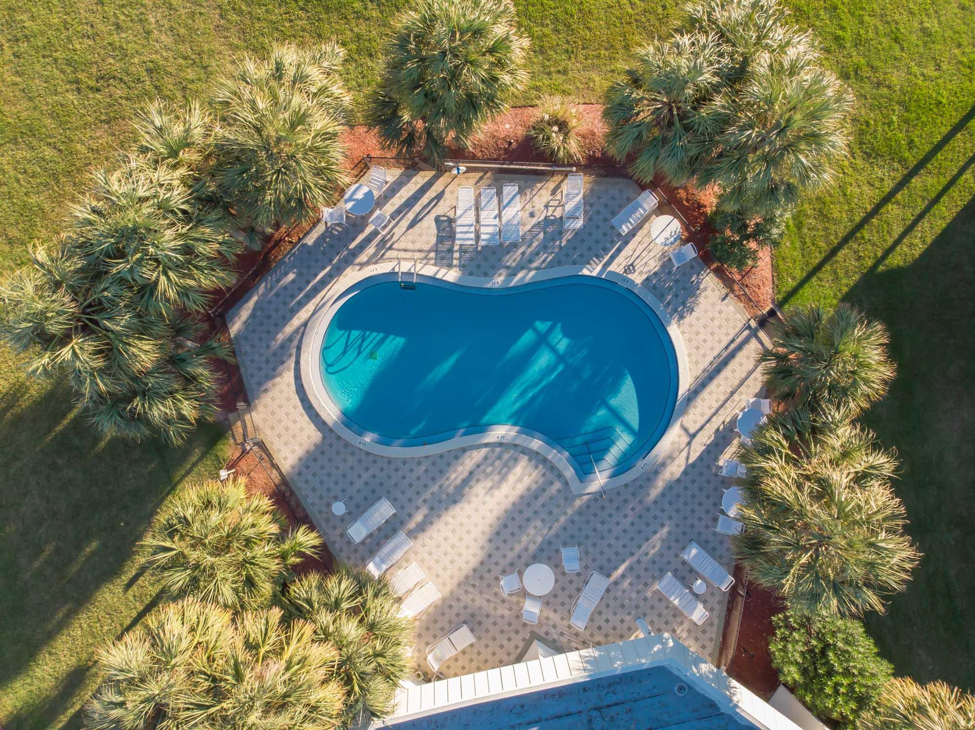 2000 Scenic Gulf Drive, Unit 5 Miramar Beach, FL 32550 - Photo 51 of 54 a view of a house with a yard and sitting area