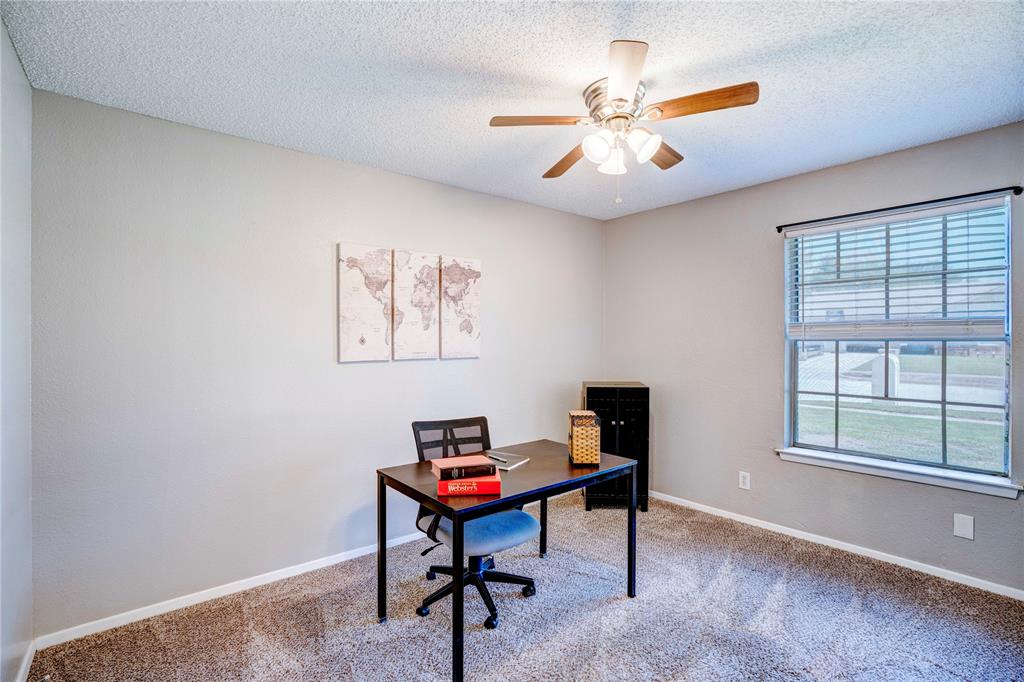 6028 Ridgecrest Drive Watauga, TX 76148 - Photo 23 of 40 a view of a workspace with furniture and a window