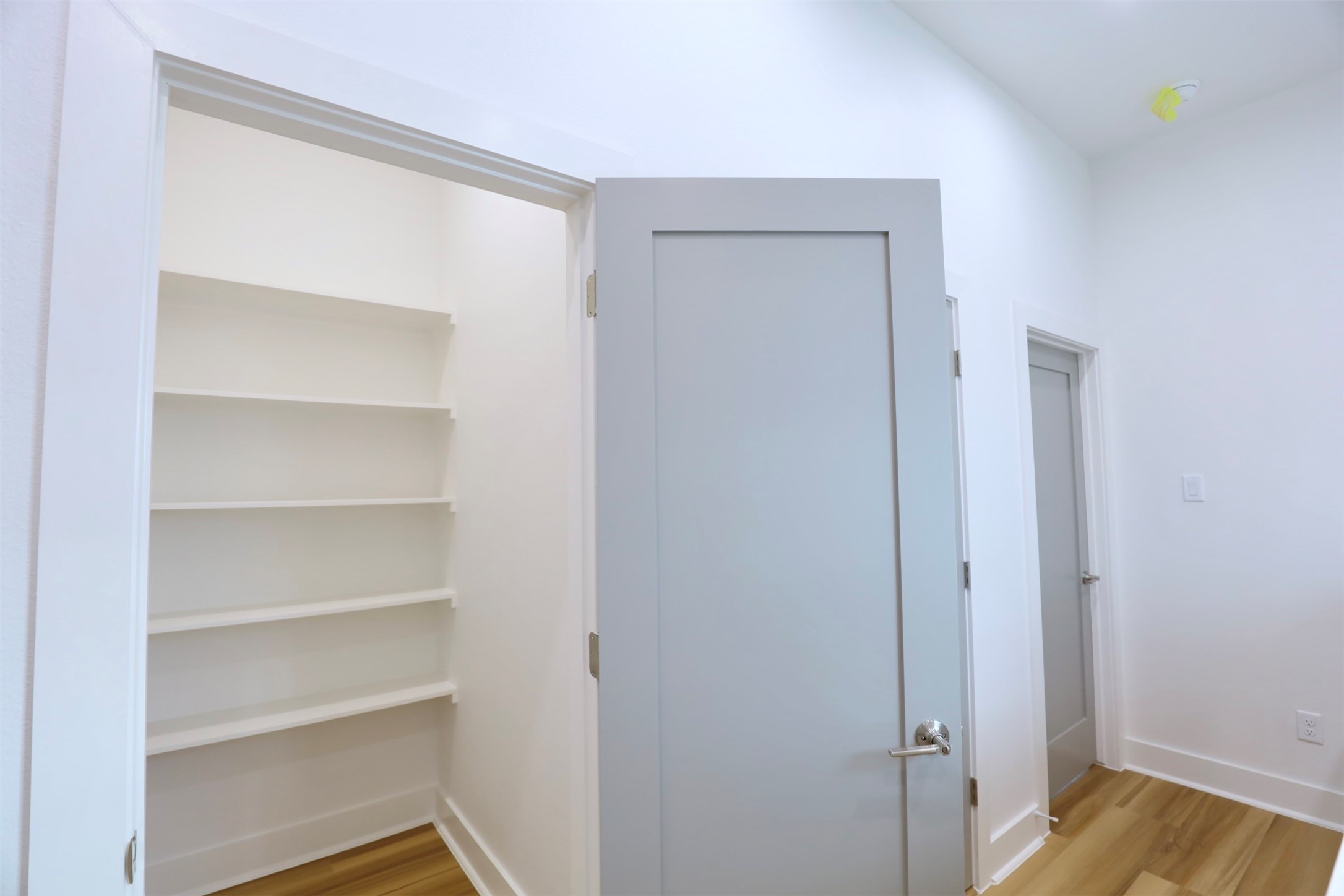 421 East 41st Street Houston, TX 77022 - Photo 27 of 32 a view of walk in closet with empty racks