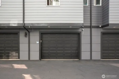 a view of a large building in front of a yard